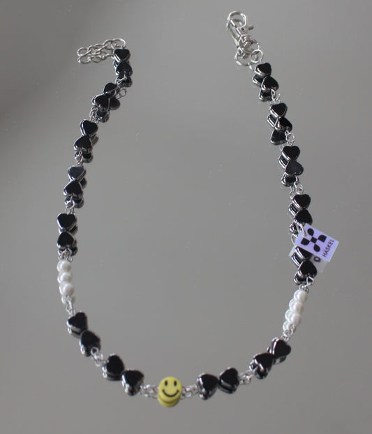 A  ASMILEY IN BLACK GLASS DRESSED