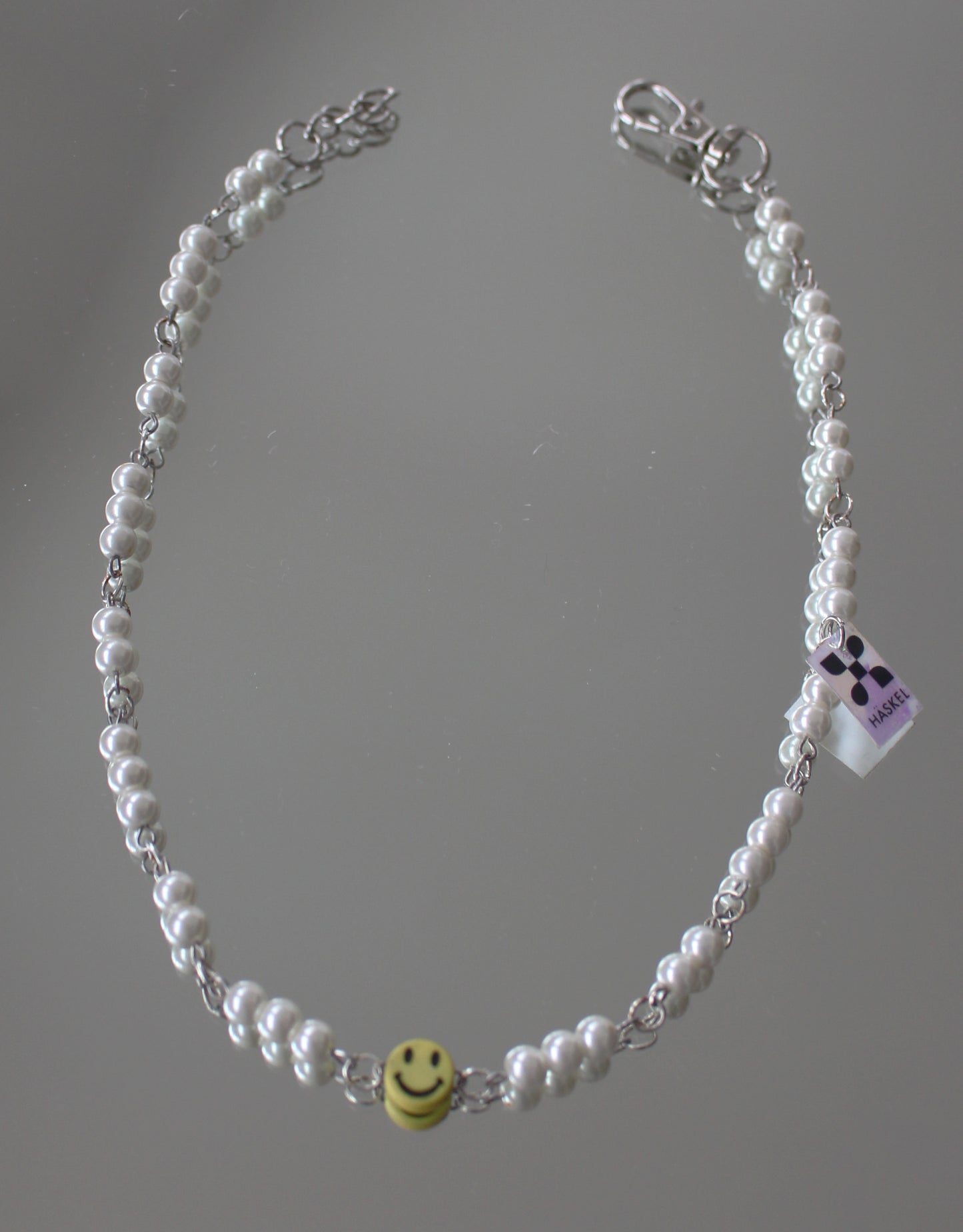 A  ASMILEY IN WHITE GLASS DRESSED