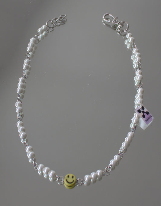 A  ASMILEY IN WHITE GLASS DRESSED