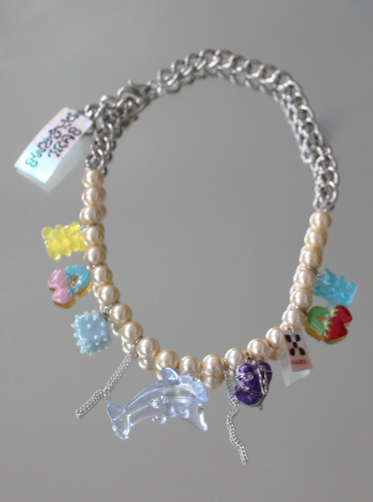 A BI DOLPHIN NECKLACE