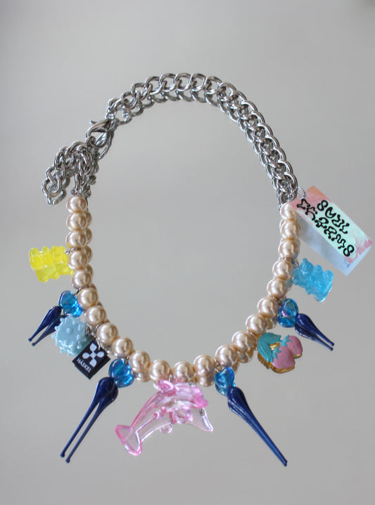 A BLUE SPIKES DOLPHIN NECKLACE