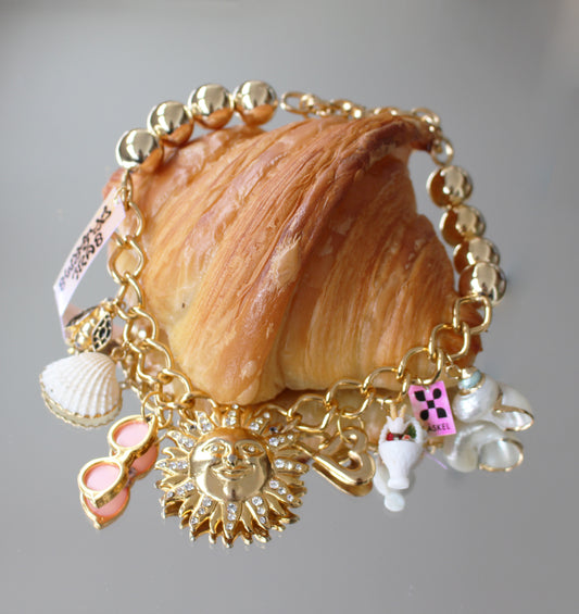 A ALMA SUN CHARM NECKLACE