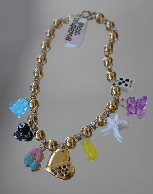 A AGoLD CHARM BACK NECKLACE