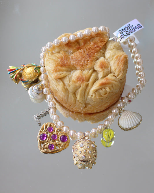 A AMARBLE CHARM NECKLACE